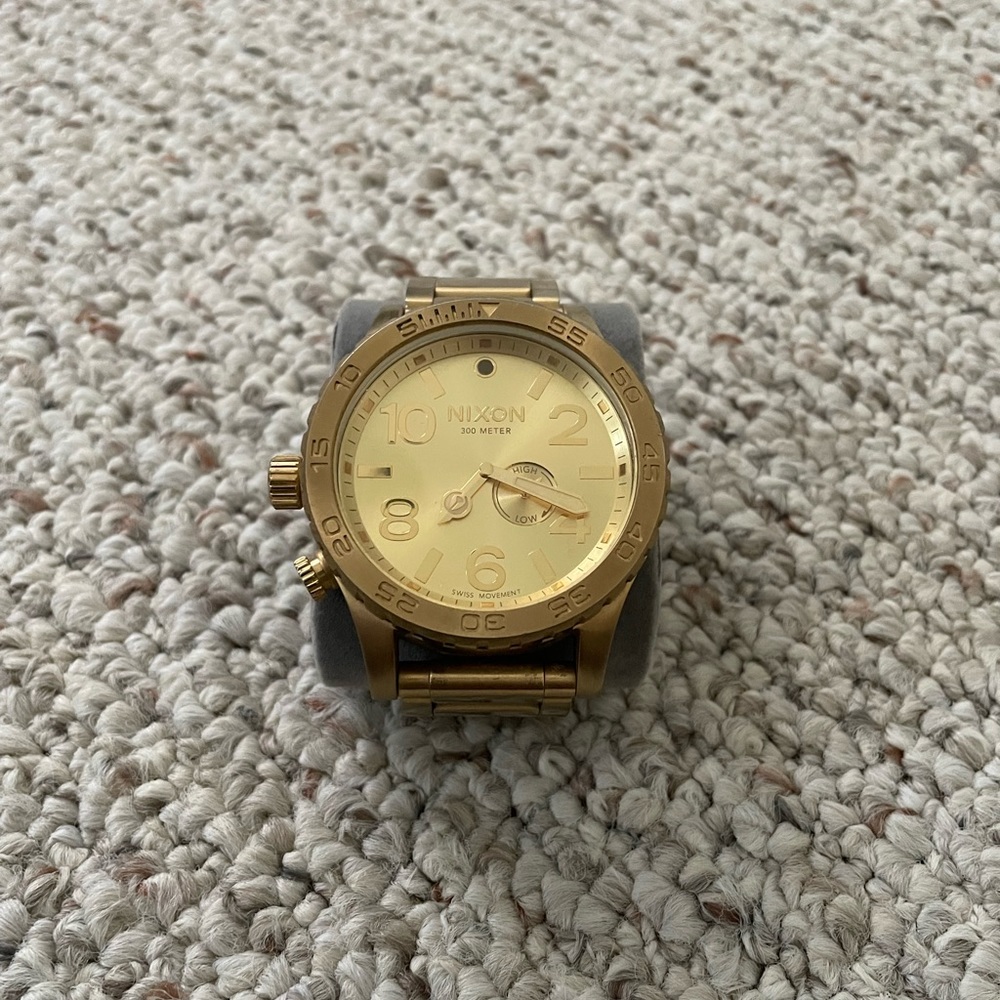 Gold large face NIXON watch
